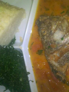 A picture of Fish stew and fried kales.