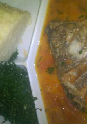 A picture of Fish stew and fried kales.