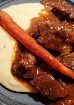 A picture of Daube de boeuf on bacon polenta.