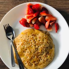 A picture of Wholemeal Pancakes with fresh strawberries.