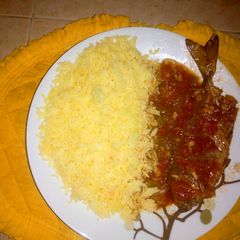 A picture of Turmeric rice with fish stew.