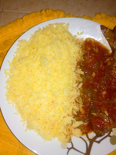 A picture of Turmeric rice with fish stew.