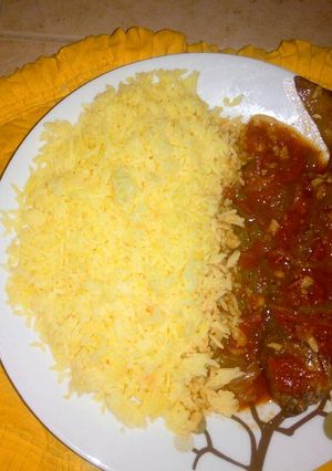 A picture of Turmeric rice with fish stew.