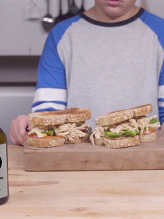 A picture of Shredded chicken, paprika and avocado sandwich.