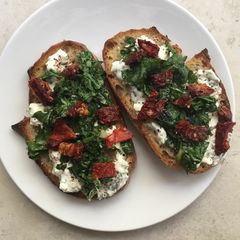 A picture of Cottage cheese and spinach on toast.
