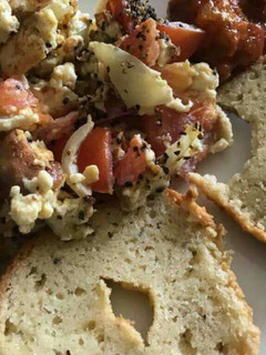A picture of Sliced bread with scrumble egg and cabbage.