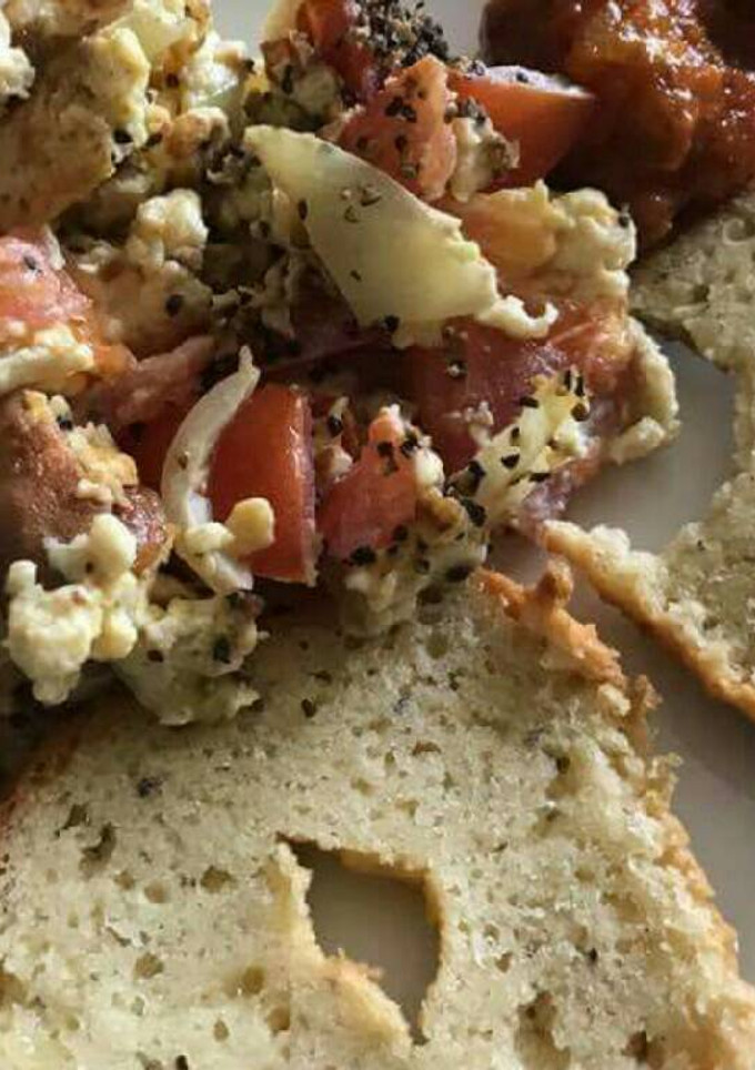 A picture of Sliced bread with scrumble egg and cabbage.