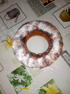 A picture of Ring Cake with Apples, Raisins, and Dark Chocolate.
