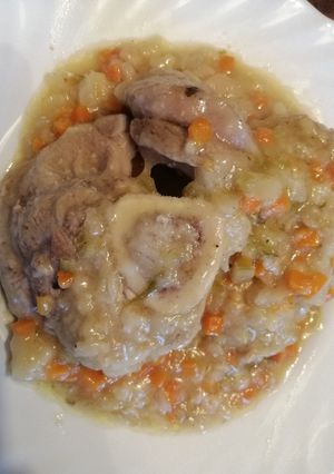 A picture of Ossobuco with Vegetables.