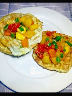 A picture of Waffles and Omellet topped with glazed Honey Tomato Mango Salsa.