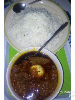 A picture of Palm oil stew with rice.