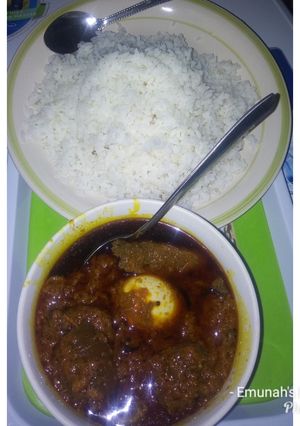 A picture of Palm oil stew with rice.
