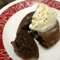 A picture of Molten lava cake with vanilla icecream.