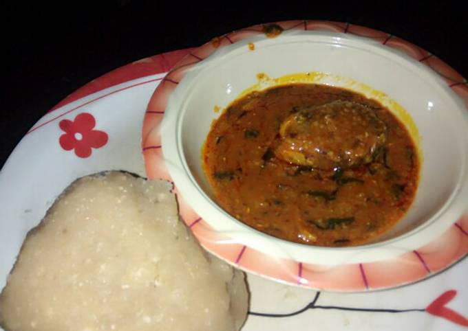 Eba and my local beans soup slightly garnished with scent leaves