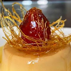 A picture of Mini egg pudding with spun sugar nest.