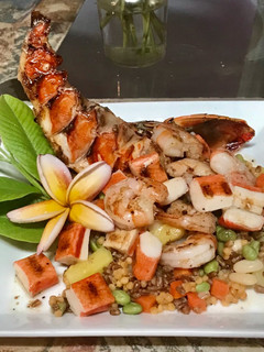 A picture of Grilled seafood with a tropical blend of high protein veggies.