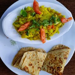 A picture of Cabbage sabzi with paratha(breakfast).
