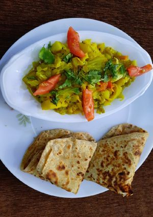 A picture of Cabbage sabzi with paratha(breakfast).