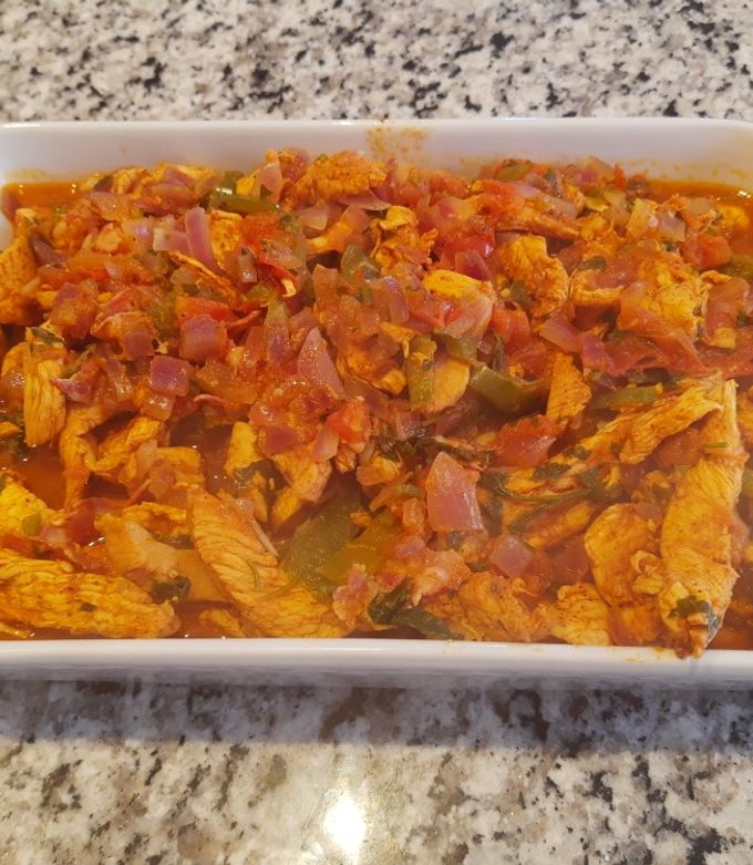 Una foto de Fajitas de Pollo con salsa de achiote
