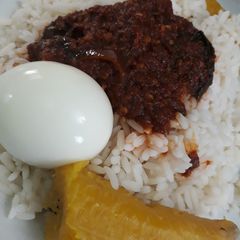 A picture of Rice,egg and ripe plantain.