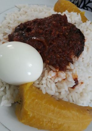 A picture of Rice,egg and ripe plantain.