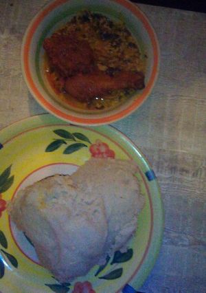 A picture of Egusi soup, chicken and pounded yam.