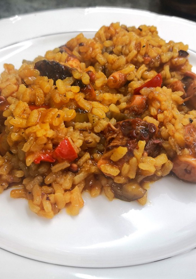 Una foto de Arroz y pulpo
