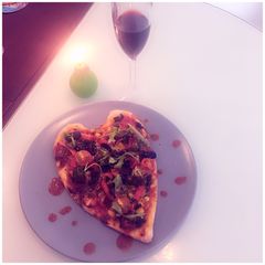 A picture of Heart Shaped Pizza.
