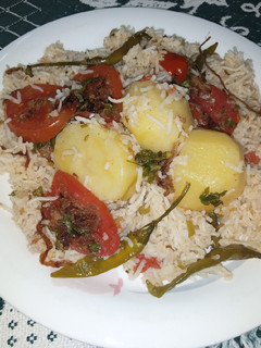 A picture of Potato And Tomato Pulao.