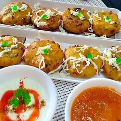 A picture of Cheese rice tikkis homemade tomato ginger chutney.