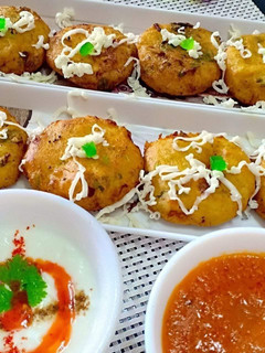 A picture of Cheese rice tikkis homemade tomato ginger chutney.