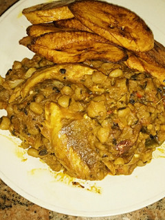 A picture of Porriage beans with fried plantain and smoked fish.