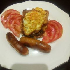 A picture of Baked sausage and fried egg on a toast # eldy breakfast contest.
