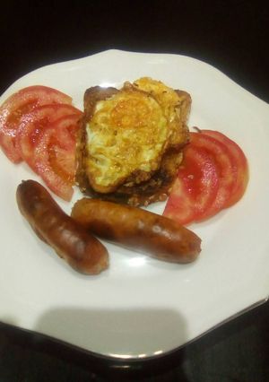 A picture of Baked sausage and fried egg on a toast # eldy breakfast contest.