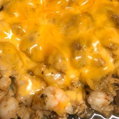 A picture of Chicken & shrimp cheese steak.