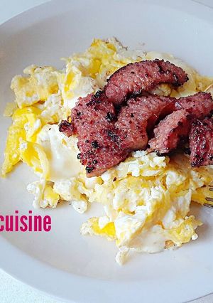 A picture of Scrambled eggs sausages.