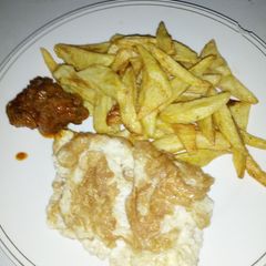 A picture of Chips and fried egg.