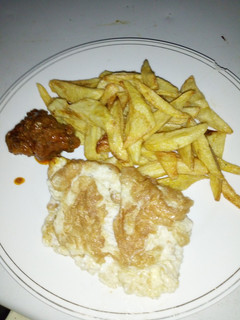 A picture of Chips and fried egg.