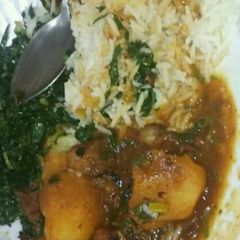A picture of Beef Stew with Waru, Served with Rice and Saute kales.