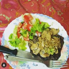 A picture of Grilled beef with mushroom sauce.