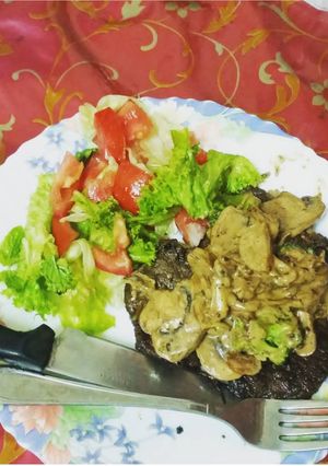 A picture of Grilled beef with mushroom sauce.