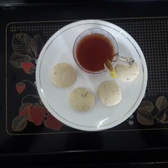 Sooji cookies with lemon tea A picture of Sooji cookies with lemon tea.