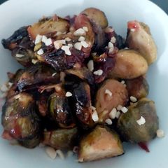 A picture of My Roasted Sprouts in orange,crushed Walnuts and Cranberry sauce.
