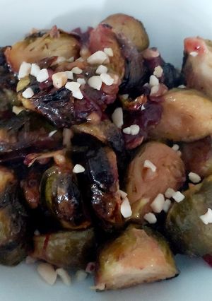 A picture of My Roasted Sprouts in orange,crushed Walnuts and Cranberry sauce.
