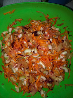 A picture of Pineapple, cucumber, carrot beet salad.