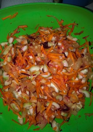 A picture of Pineapple, cucumber, carrot beet salad.