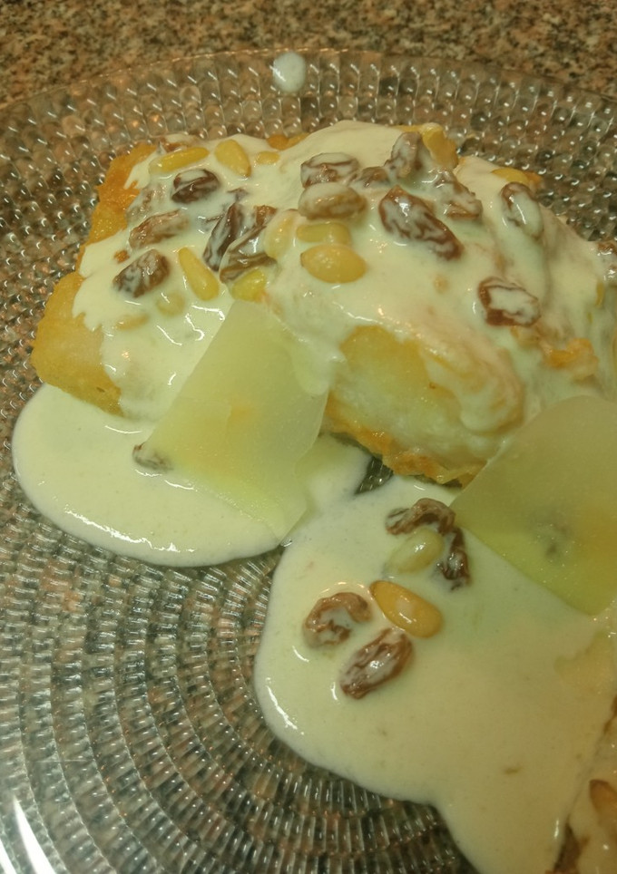 Una foto de Bacalao a la parmesana con pasas y piñones