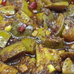A picture of Hot and sour mango pickle in oil (Aam tel).
