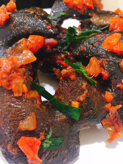 A picture of Spicy fried snail in sauce.