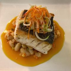 A picture of Blue eye cod with cannellini beans, scallion and radish salad with soy orange glaze.